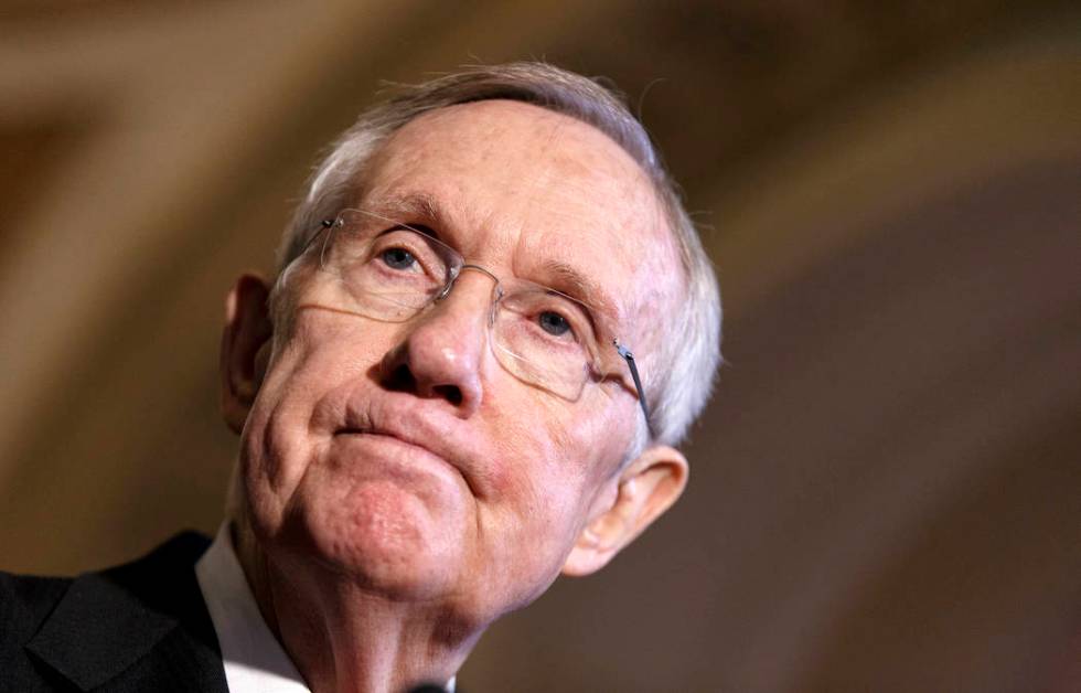 This April 8, 2014, file photo shows Senate Majority Leader Harry Reid of Nevada pausing during ...