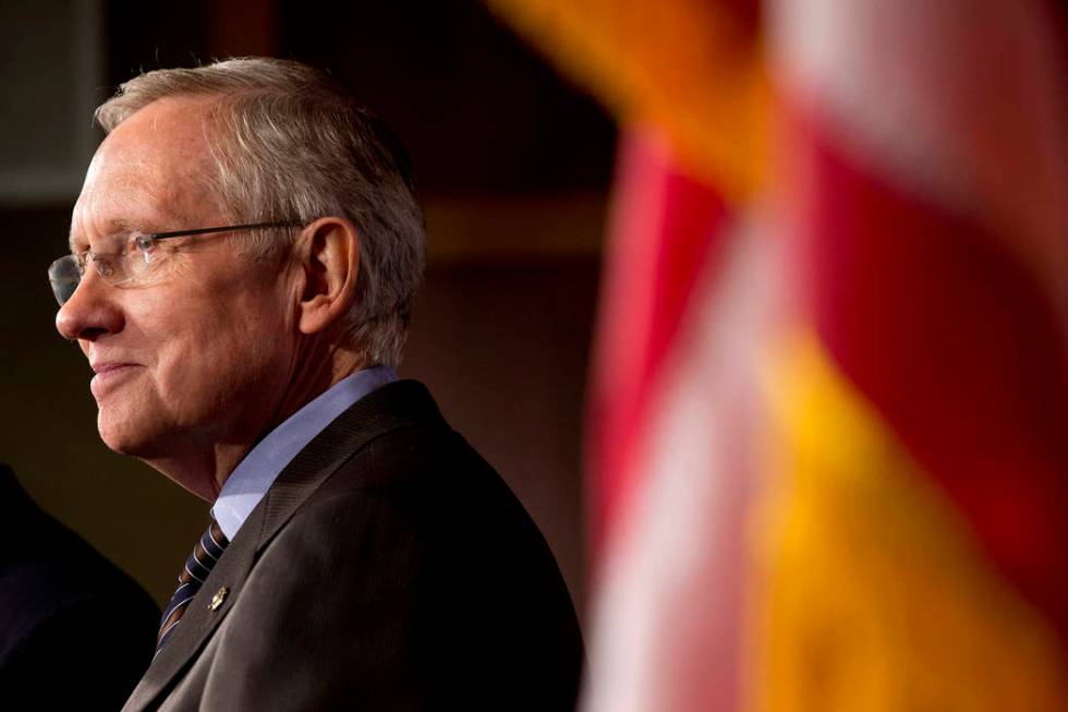 Senate Majority Leader Harry Reid of Nevada listens during a news conference on Capitol Hill in ...