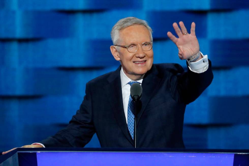 U.S. Sen. Harry Reid, D-Nev., waves from the podium during the third day of the Democratic Nati ...