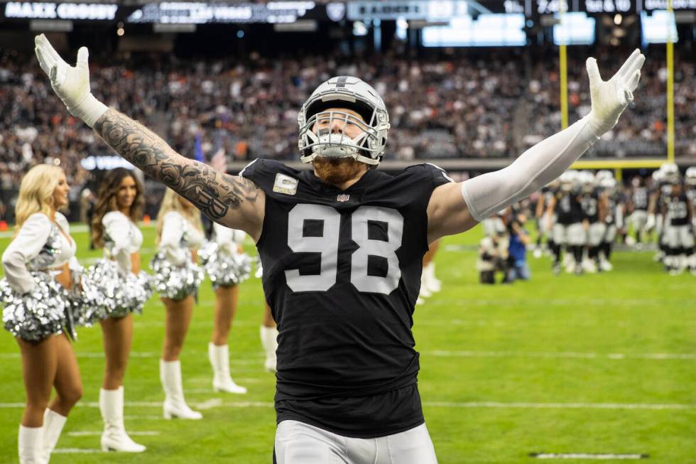 Raiders defensive end Maxx Crosby (98) is announced before the start of an NFL football game ag ...