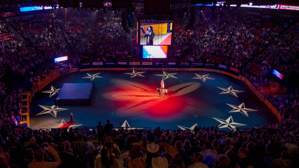 Drake Milligan sings the National Anthem at the start of the opening night of Wrangler National ...