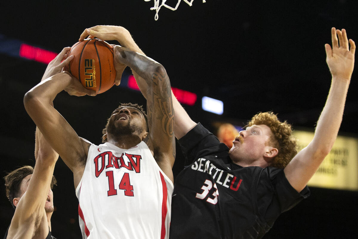 UNLV Rebels forward Royce Hamm Jr. (14) shoots against Seattle Redhawks guard Rip Economou (0) ...