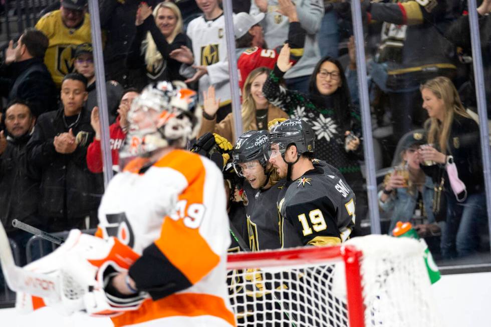 Golden Knights center William Karlsson (71) and right wing Reilly Smith (19) celebrate a goal s ...