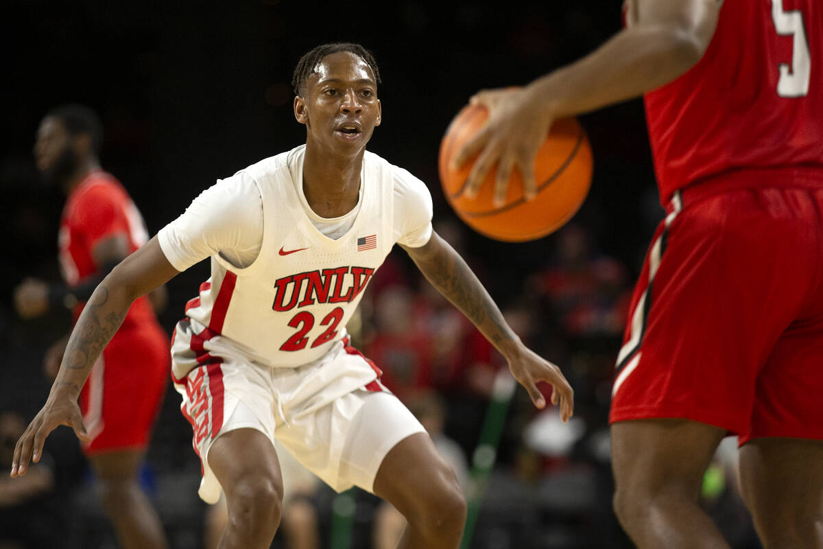 UNLV Rebels guard Josh Baker (22) defends Hartford Hawks guard Cameron McCravy (5) during the f ...