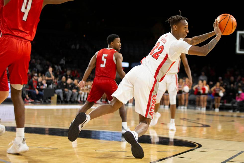 UNLV Rebels guard Josh Baker (22) passes as the team moves up the court during the first half o ...