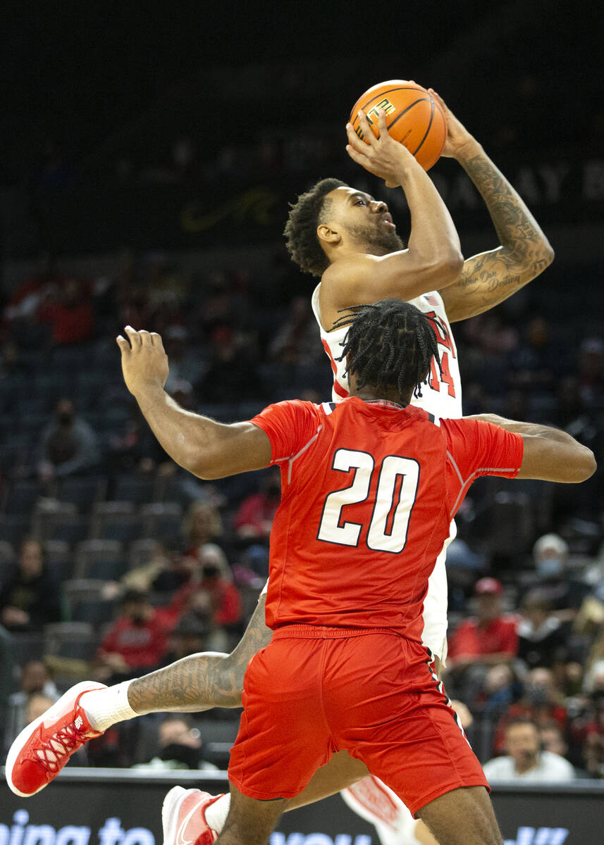 UNLV Rebels forward Royce Hamm Jr. (14) shoots against Hartford Hawks guard Austin Williams (20 ...