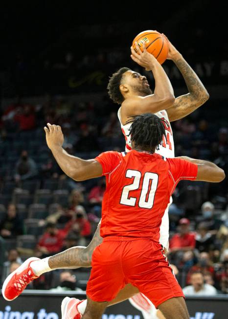 UNLV Rebels forward Royce Hamm Jr. (14) shoots against Hartford Hawks guard Austin Williams (20 ...