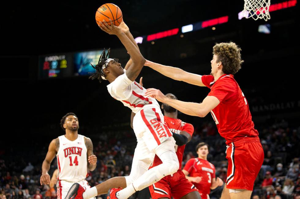 UNLV Rebels forward Donovan Williams (3) shoots against Hartford Hawks forward Hunter Marks (0) ...