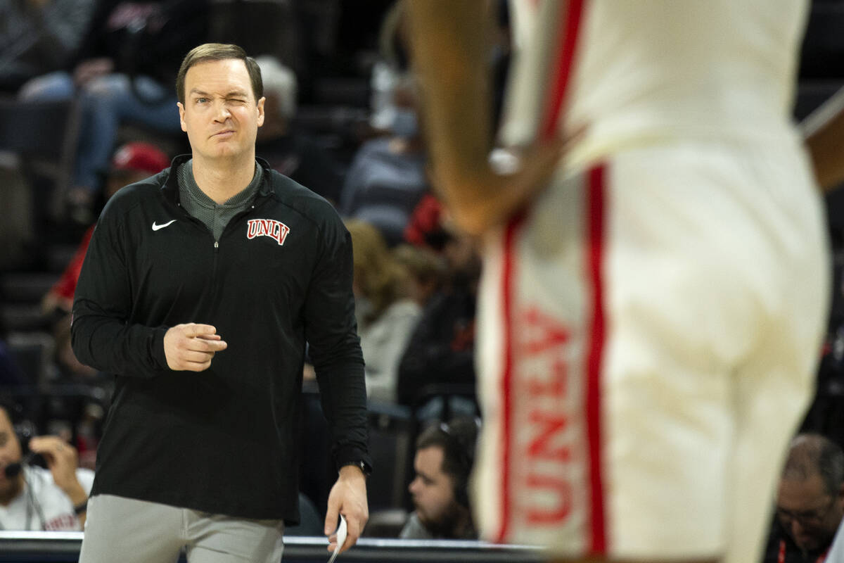 UNLV Rebels head coach Kevin Kruger winks at forward Royce Hamm Jr. (14) during the second half ...