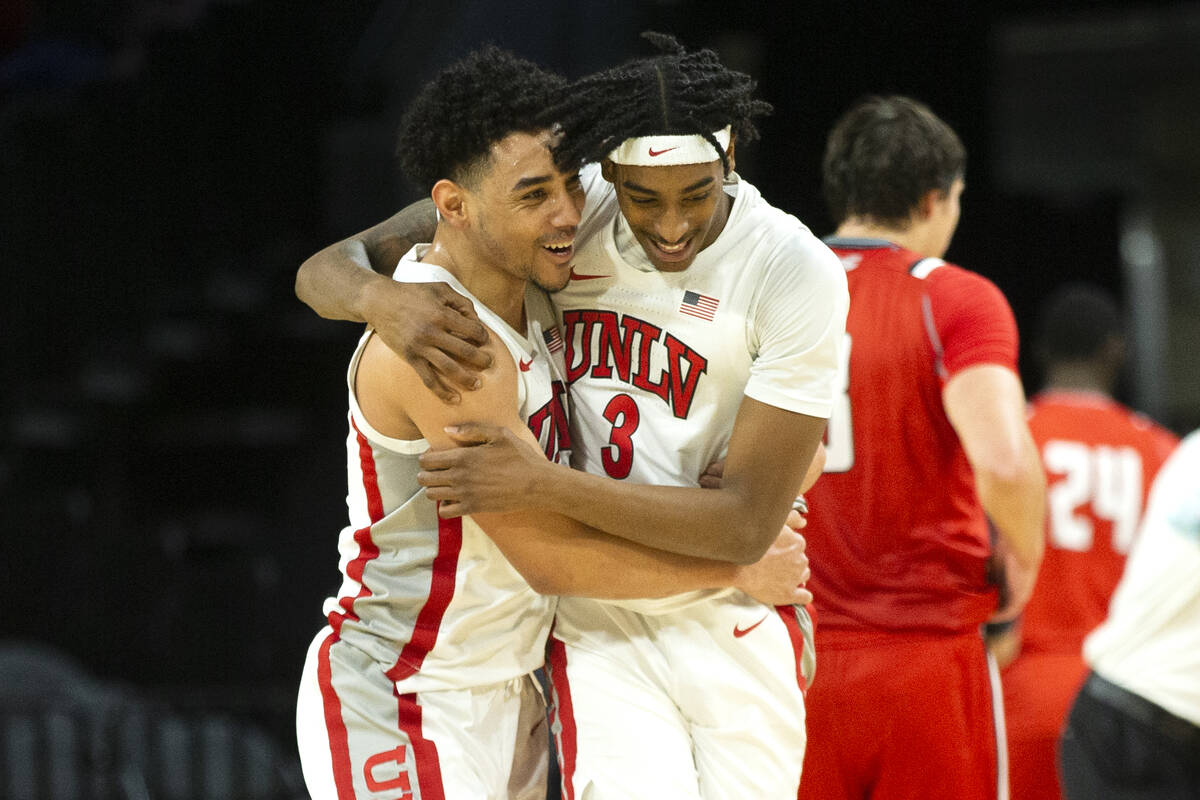 UNLV Rebels guard Marvin Coleman (31) celebrates with forward Donovan Williams (3) after winnin ...