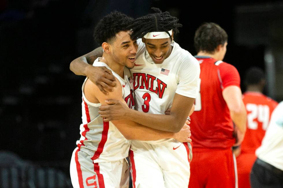 UNLV Rebels guard Marvin Coleman (31) celebrates with forward Donovan Williams (3) after winnin ...