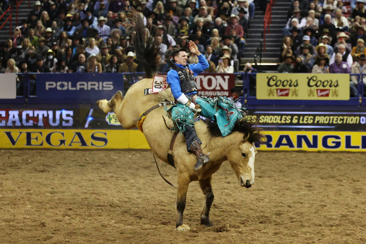 Jess Pope of Waverly, Kan., competes in the bareback riding event during the tenth go-round of ...