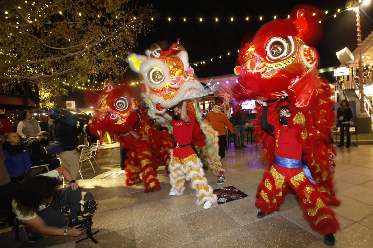 Members of Lohan School of Shaolin perform lion dance, Saturday, Dec. 11, 2021, during Wake Up ...