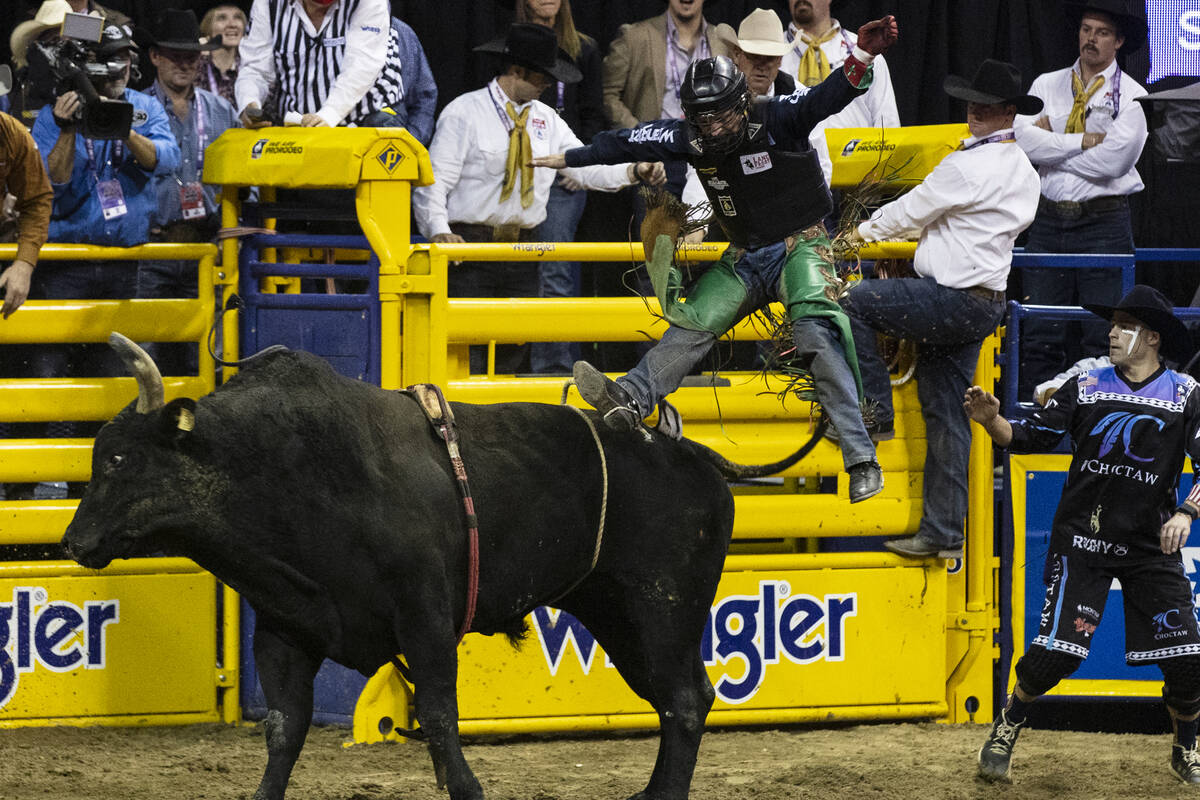 Josh Frost of Randlett, Utah thrown from Barracuda in bull riding during the fourth round of th ...
