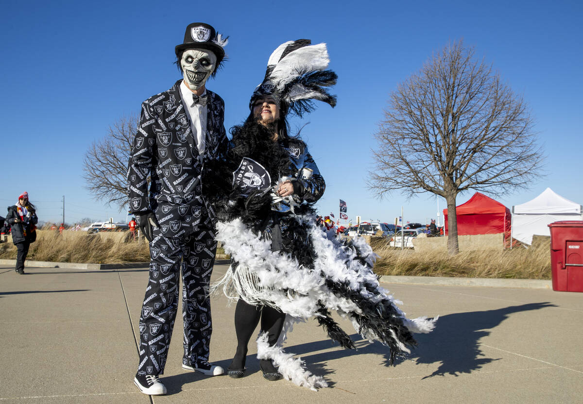 Raiders fans Scott Boe and Kami Glenn of Cortez, Colorado, are dressed up and ready as the wind ...