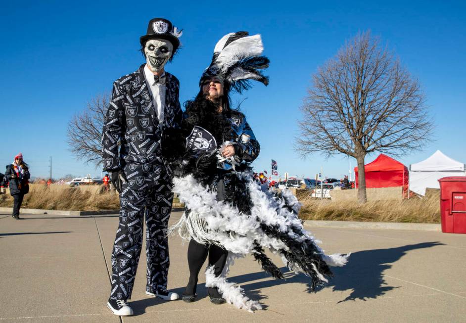 Raiders fans Scott Boe and Kami Glenn of Cortez, Colorado, are dressed up and ready as the wind ...