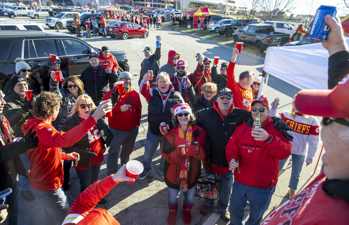 Fans mostly with the Henry Shine Company toast their team in the red lot tailgate before the Ra ...