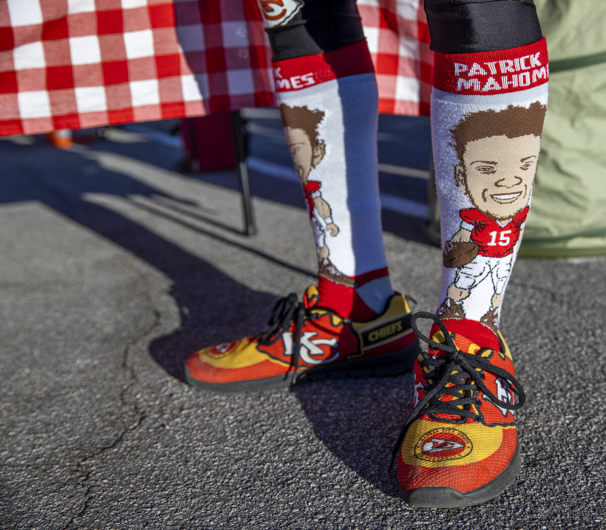 A Kansas City fan wears a pair of Patrick Mahomes socks in the red lot tailgate before the Raid ...