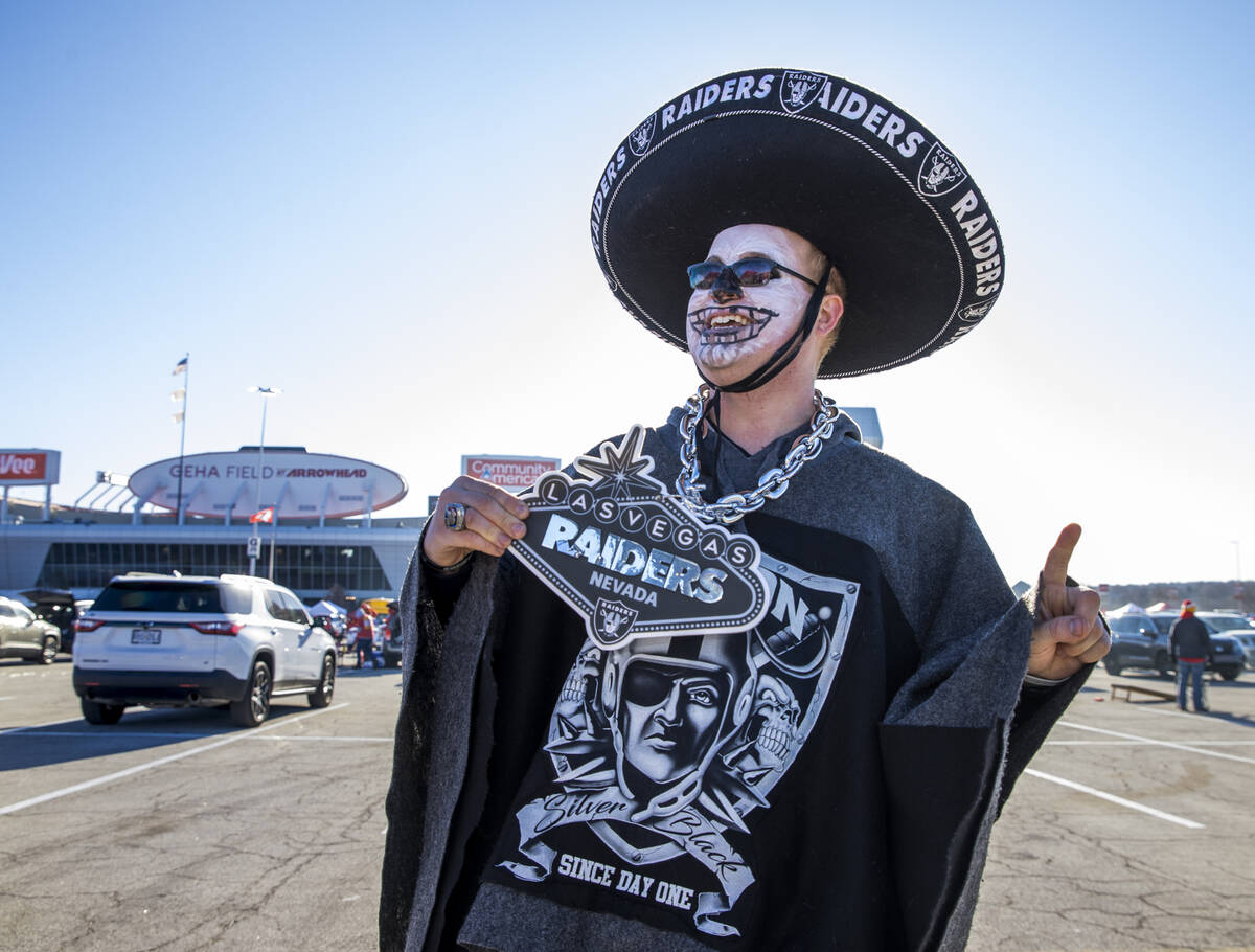 Raiders fan Scottie Lutz of Lee Summit, MO., is decked out and ready in the red lot tailgate be ...