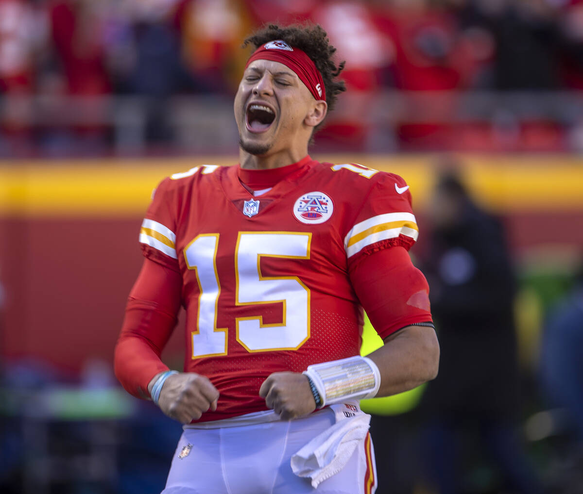 Kansas City Chiefs quarterback Patrick Mahomes (15) pumps up his team as they ready toffee the ...
