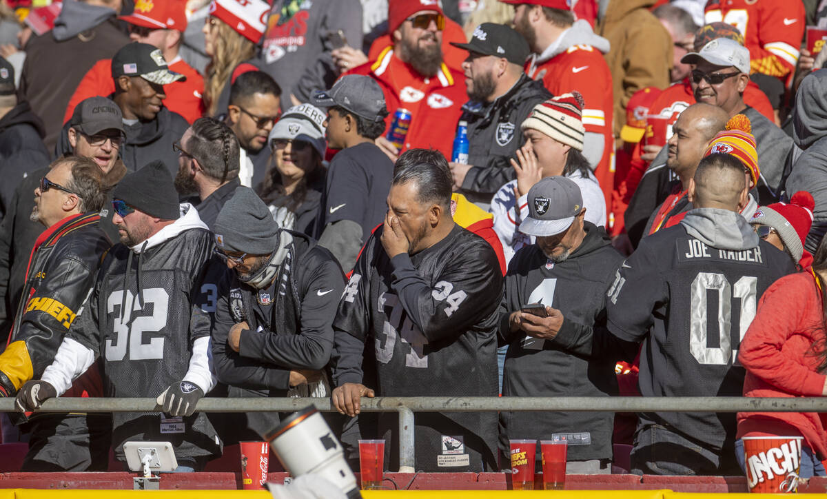 Raiders fans are dismayed as the Kansas City Chiefs continue to score during the first half of ...