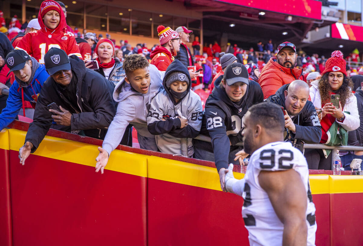 Raiders fans greet defensive end Solomon Thomas (92) as he runs off the field after losing to t ...