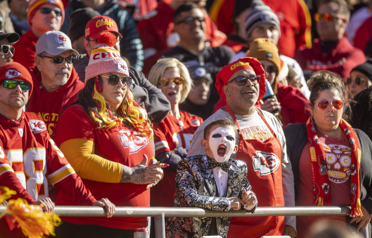 A young Raiders fan cheers amongst those from the Kansas City Chiefs during the first half of a ...