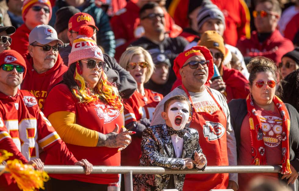A young Raiders fan cheers amongst those from the Kansas City Chiefs during the first half of a ...