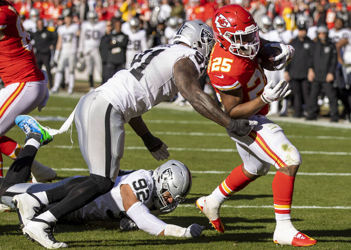 Kansas City Chiefs running back Clyde Edwards-Helaire (25) steps over the goal line as Raiders ...