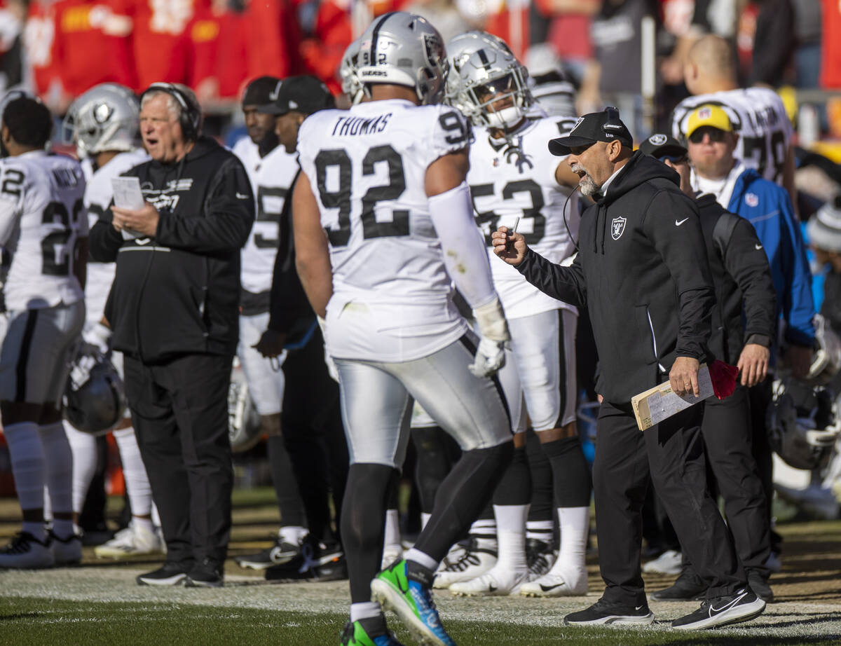 Raiders interim head coach Rich Bisaccia yells to his players as they are down a lot to Kansas ...