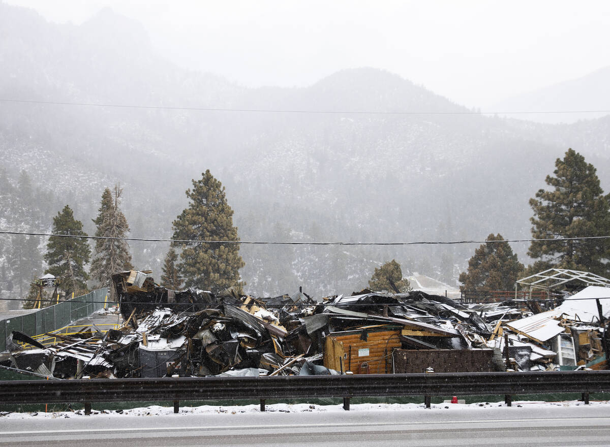 Debris of the former Mount Charleston Lodge is seen as light snow fall on the Mt. Charleston ar ...