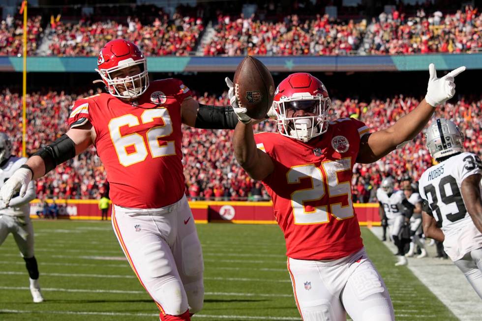 Kansas City Chiefs running back Clyde Edwards-Helaire (25) celebrates after scoring on a touchd ...
