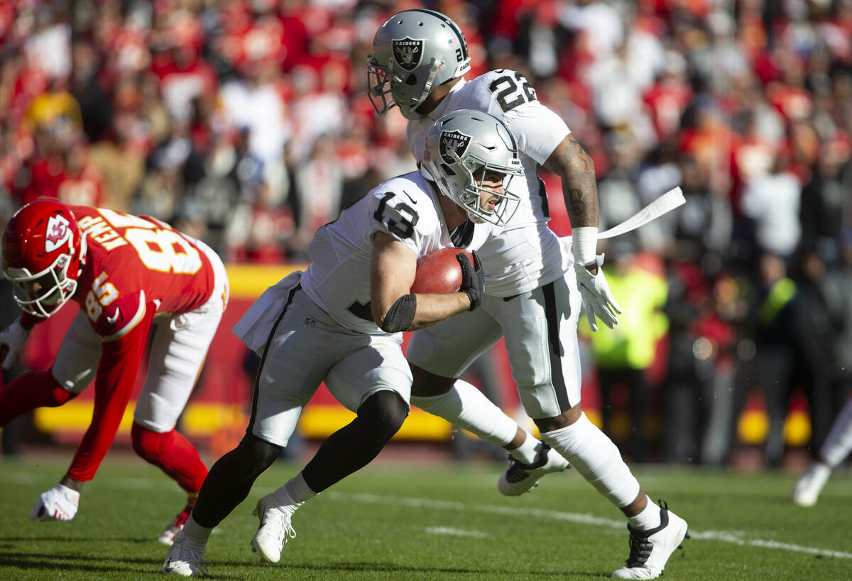 Raiders wide receiver Hunter Renfrow (13) runs with the football on a punt return during the fi ...