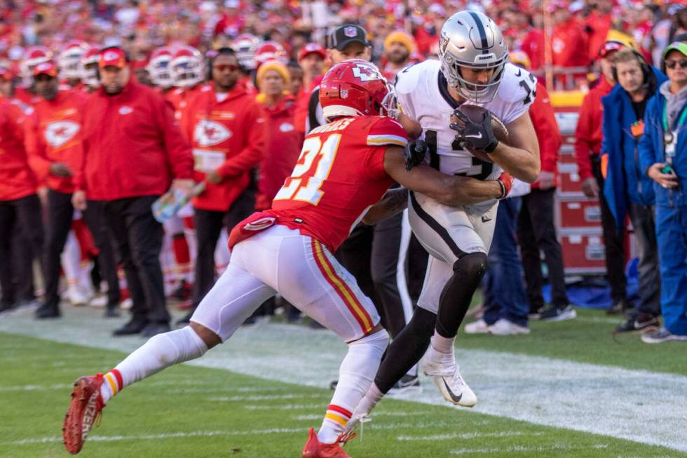 Raiders wide receiver Hunter Renfrow (13) tries to run past Kansas City Chiefs cornerback Mike ...