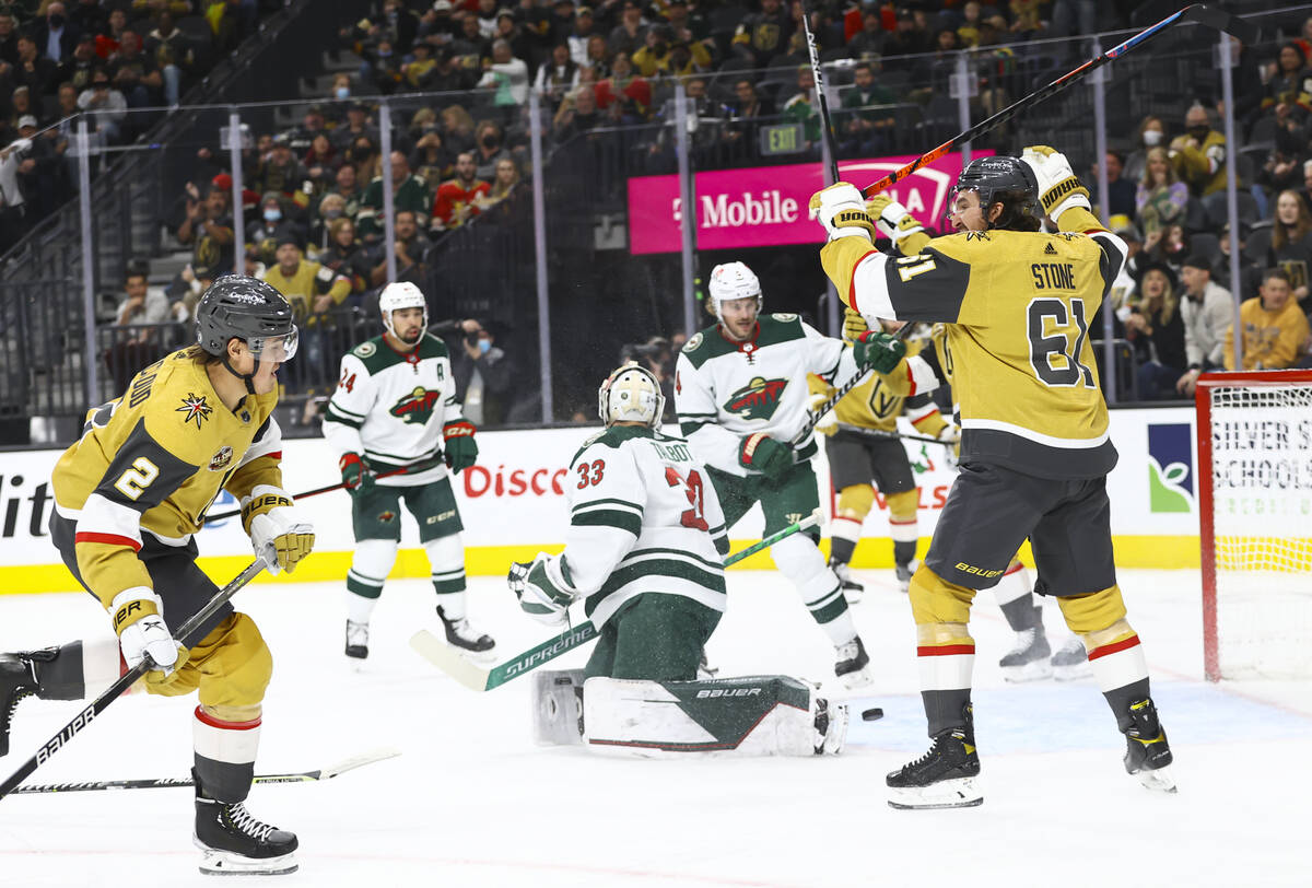 Golden Knights defenseman Zach Whitecloud (2) scores a goal past Minnesota Wild goaltender Cam ...