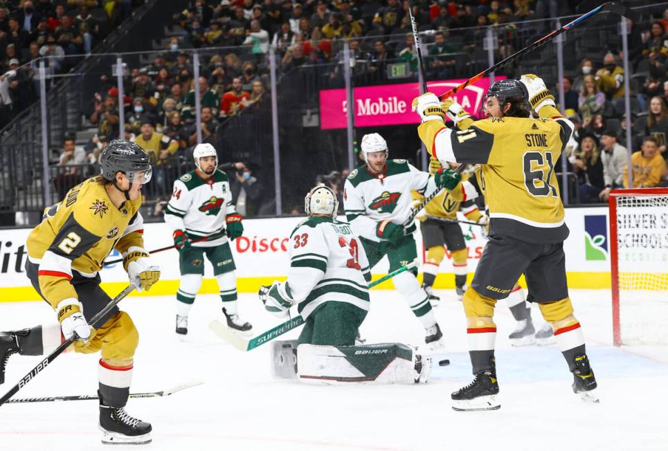 Golden Knights defenseman Zach Whitecloud (2) scores a goal past Minnesota Wild goaltender Cam ...