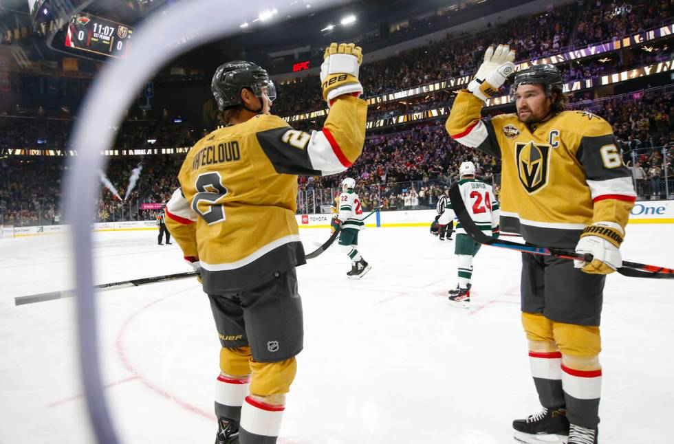 Golden Knights defenseman Zach Whitecloud (2) celebrates his goal against the Minnesota Wild wi ...