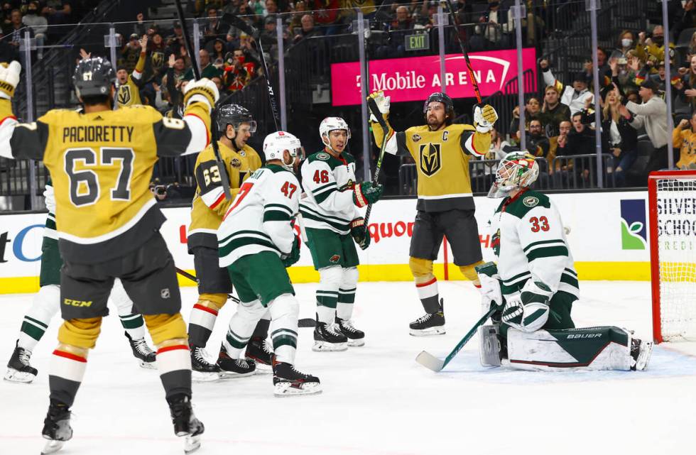 Golden Knights right wing Evgenii Dadonov (63) scores a goal past Minnesota Wild goaltender Cam ...