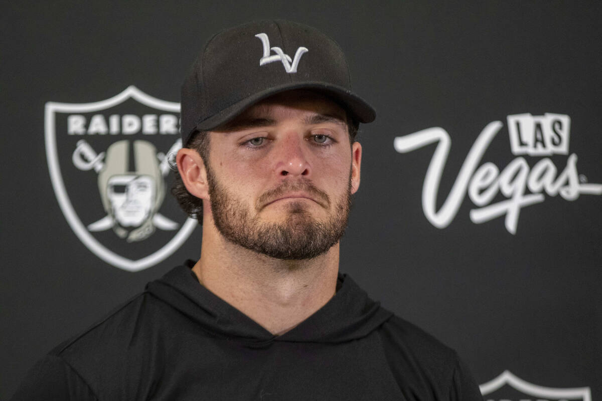 Raiders quarterback Derek Carr takes media questions during the postgame news conference after ...