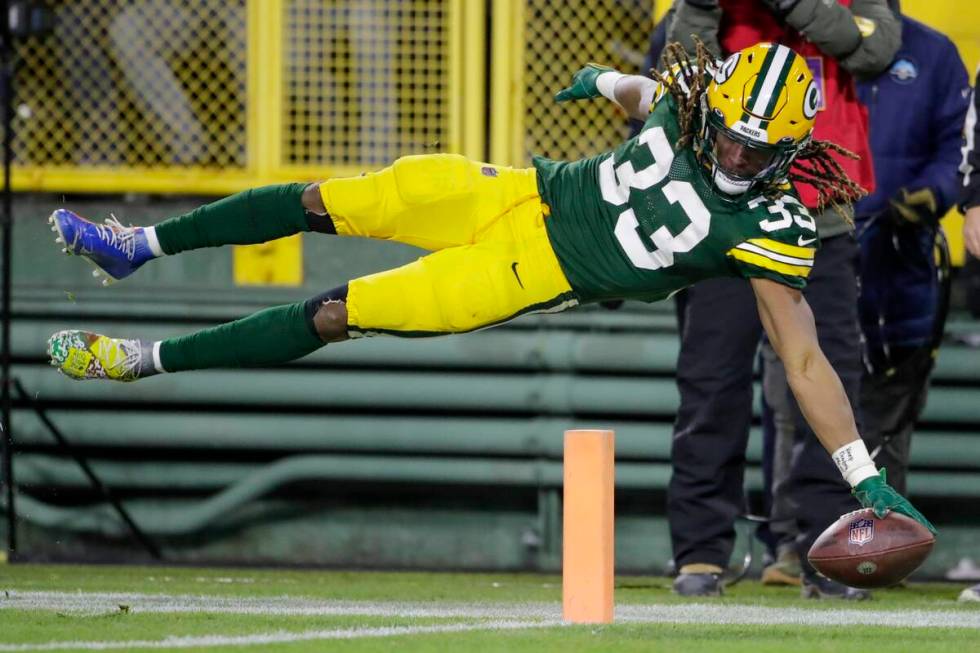 Green Bay Packers' Aaron Jones dives into the end zone for a touchdown during the second half o ...