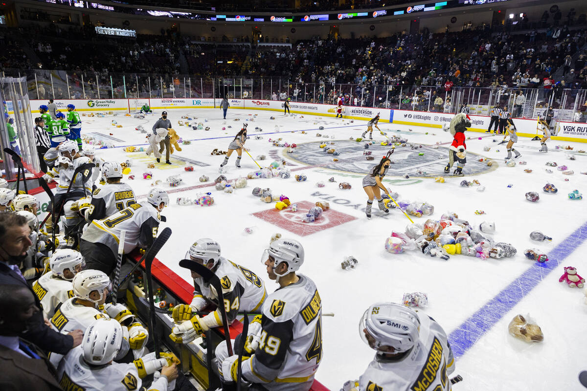 Fans throw hundreds of stuffed animals on the ice after the first Silver Knights goal during th ...
