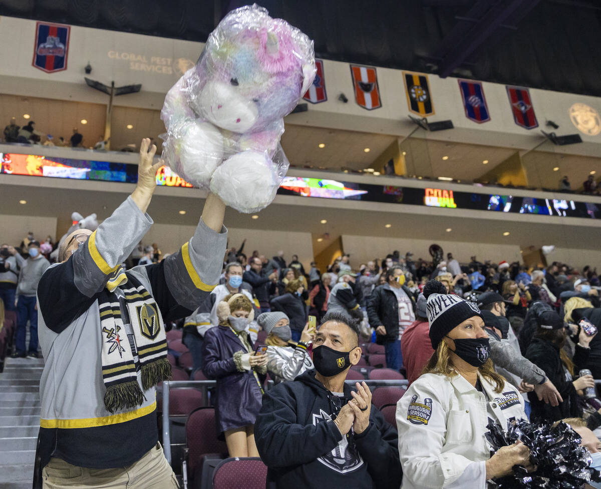Fans throw stuffed animals on the ice after the first Silver Knights goal during the “Lu ...
