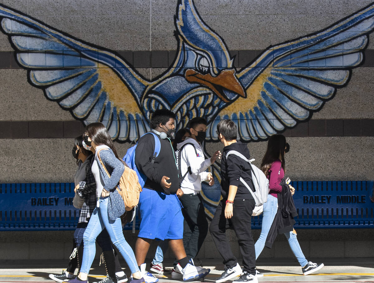 Students at Bailey Middle School walk in the hallway during recess on Friday, Dec. 10, 2021, in ...