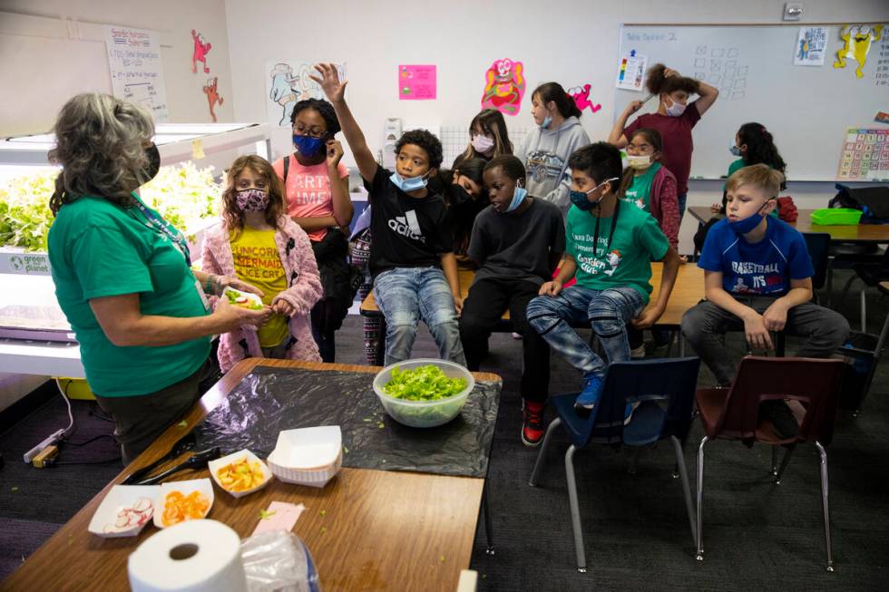 Lisa Mullinix, gardening humanities teacher, gives instructions to her students during a Garden ...