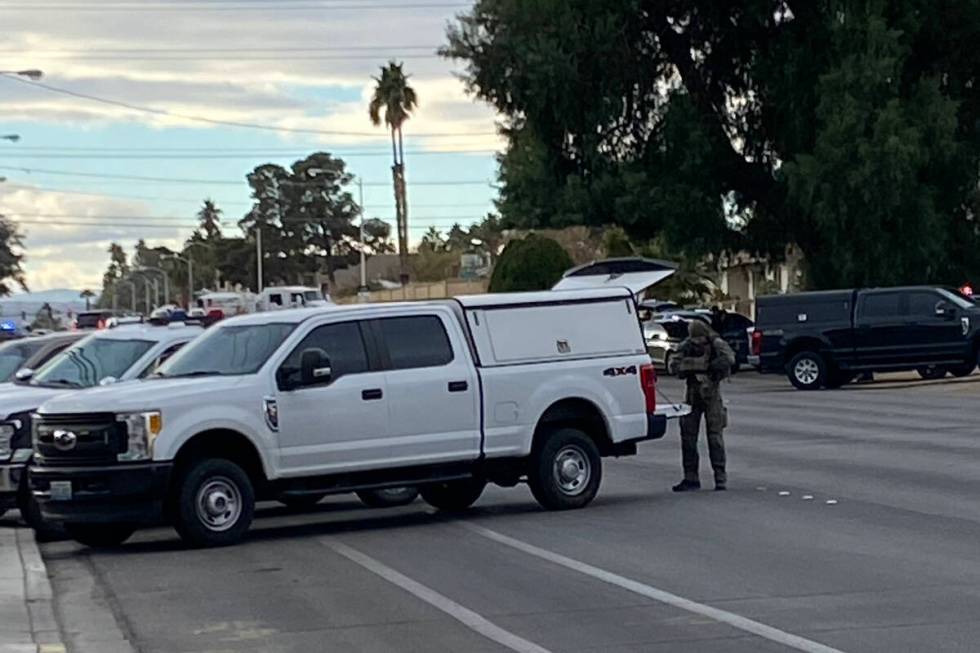 Las Vegas police, including a SWAT unit respond to a neighborhood near a middle school in south ...