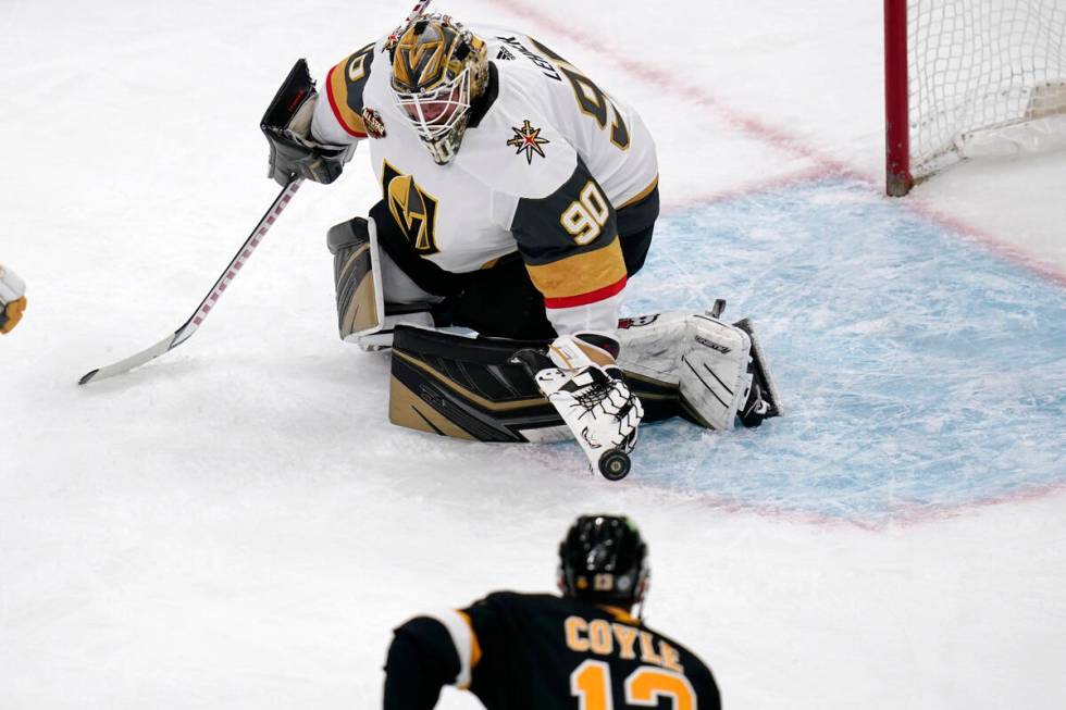 Vegas Golden Knights goaltender Robin Lehner (90) makes a save on a shot by Boston Bruins cente ...