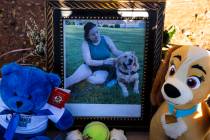 A photograph of Tina Tintor, 23, and her dog is placed at a makeshift memorial site to honor th ...