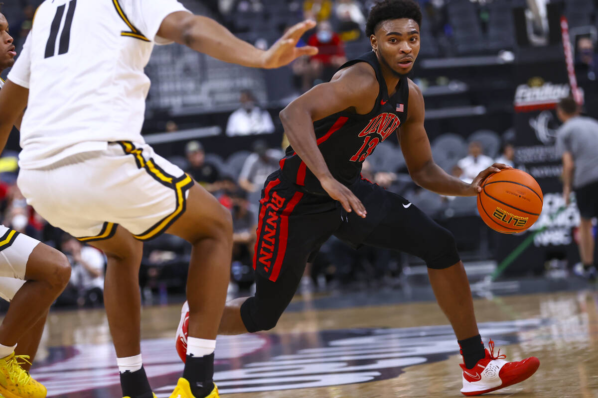 UNLV Rebels guard Bryce Hamilton (13) drives to the basket against Wichita State Shockers forwa ...