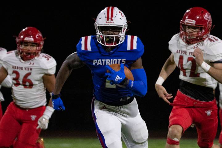 Liberty High wide receiver Germie Bernard (2) breaks through Arbor View defense during a playof ...