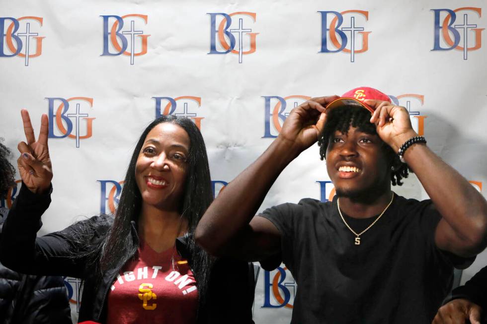 Bishop Gorman High School football player Zion Branch wears a cap of University of Southern Cal ...